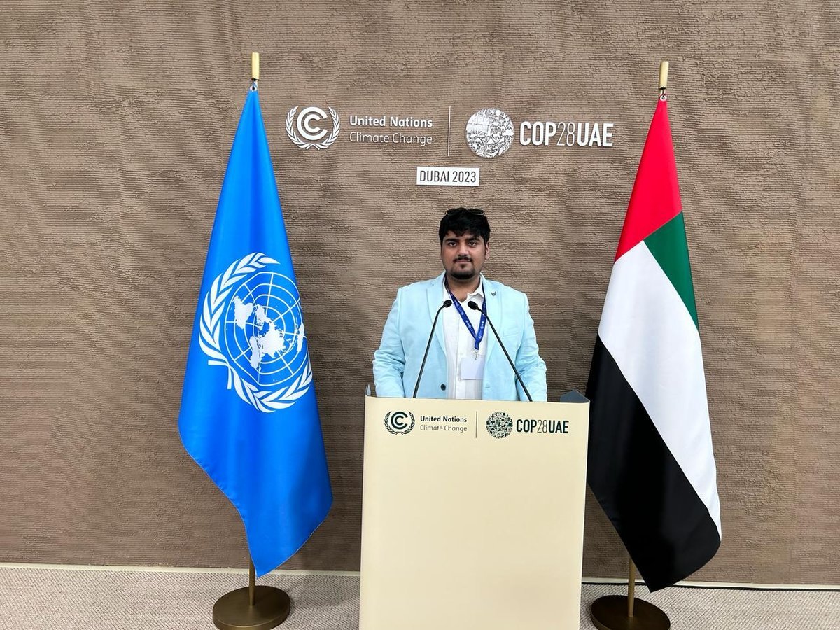 Asish Singh at a United Nations Climate Change podium at COP28 in Dubai